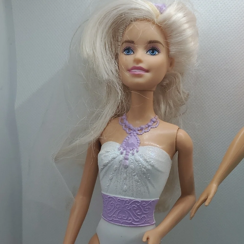 Mattel Dolls with Blonde Hair and Colorful Outfits